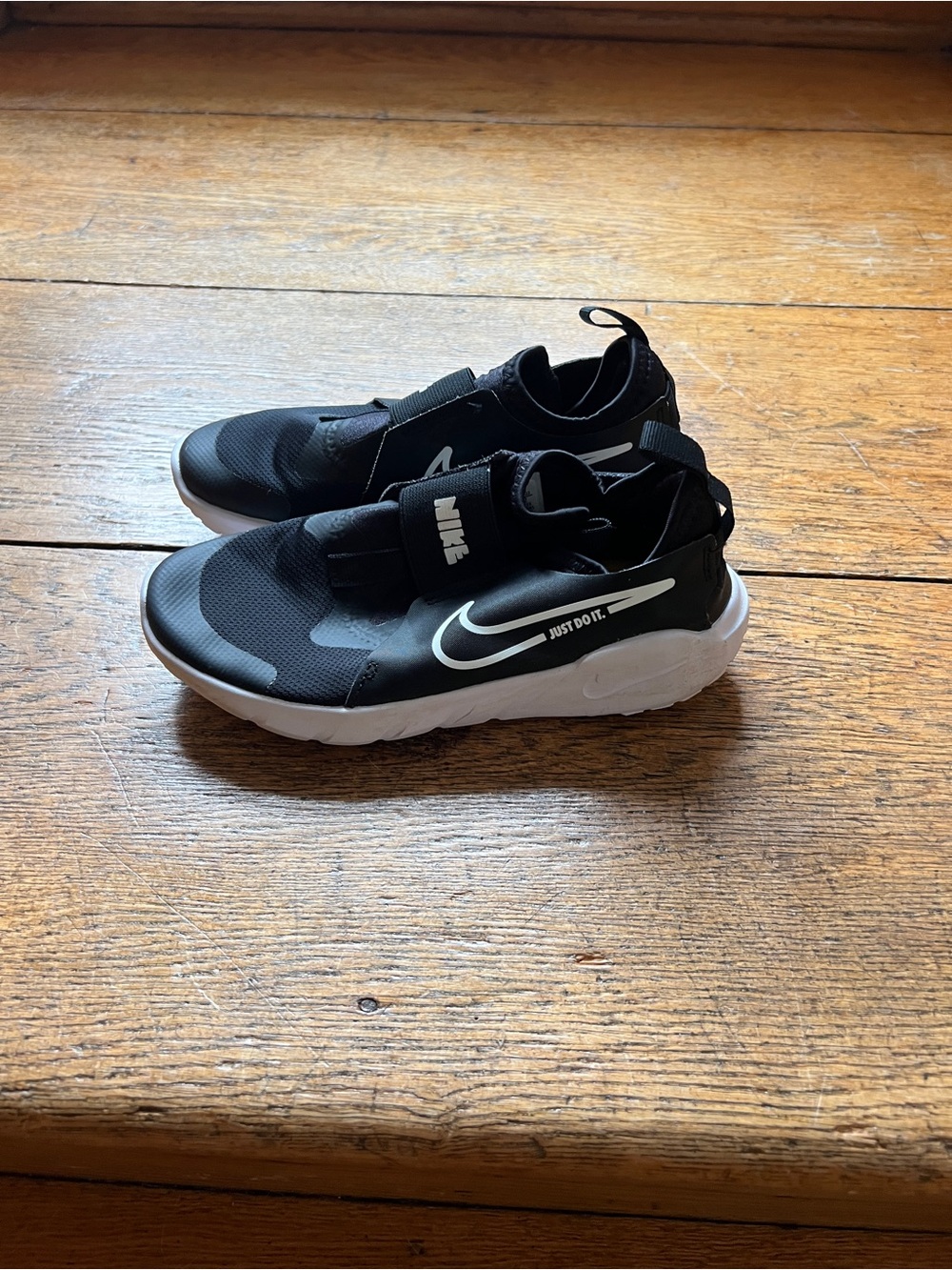 Nike Kids Black and White Slip-On Sneakers with Swoosh